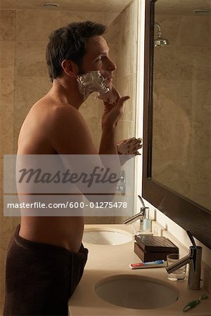 Man Shaving in Bathroom