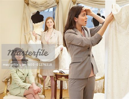 Woman in Bridal Boutique Looking at Price Tag