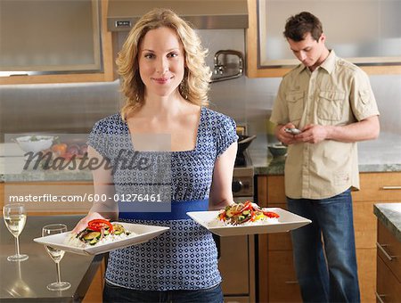 Couple Serving Dinner