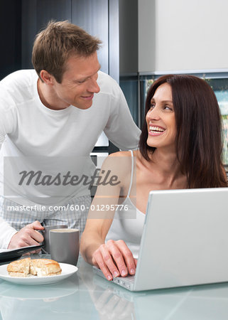 Couple Using Laptop Computer