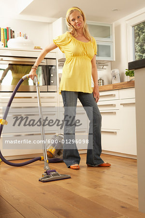 Pregnant Woman Vacuuming