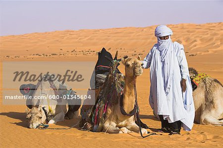 600-01345604em-Tuareg-Person-with-Camels-Erg-Ubari-Libya.jpg