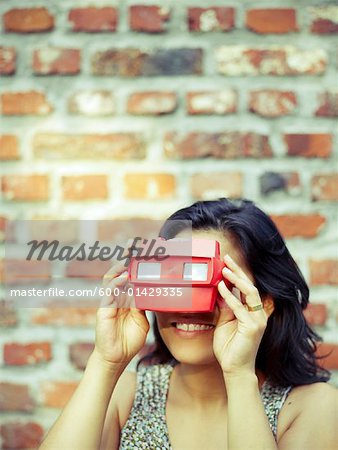 Woman Using View Master - Stock Photo - Masterfile - Premium