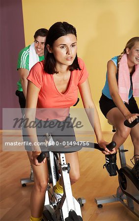 People Using Exercise Bicycles