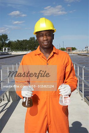 Man with Water Samples at Water Treatment Plant