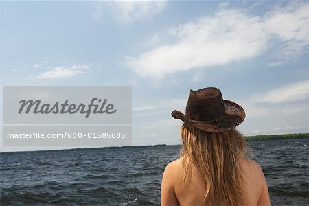 Woman Looking Out Onto Lake