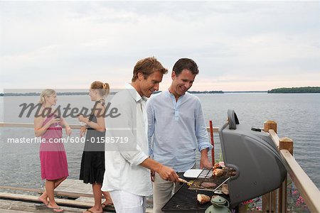 People Barbecuing, Standing by Lake