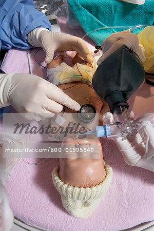 Nurses Practicing on Baby Mannequin