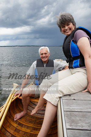 Couple on Dock with Canoe
