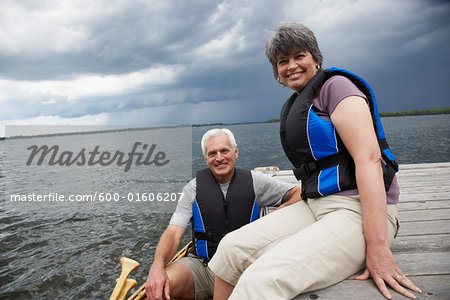 Couple on Dock with Canoe