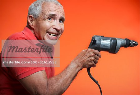 Nervous Man Holding Power Drill