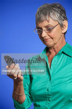 Frustrated Woman Looking at Cell Phone