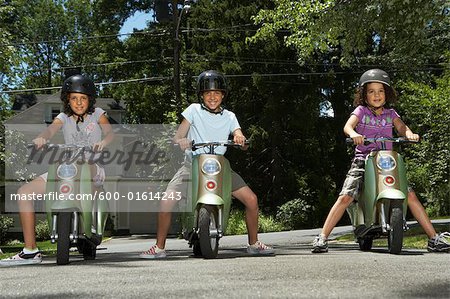 Sisters Riding Scooters