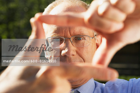 Businessman Framing with Fingers