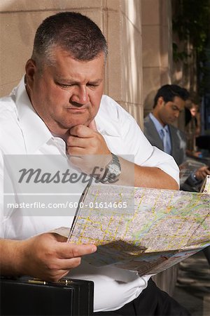 Man Looking at Map