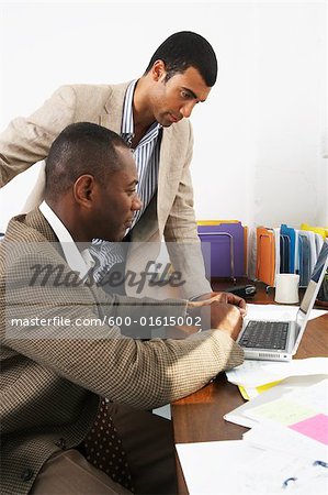Businessmen at Desk