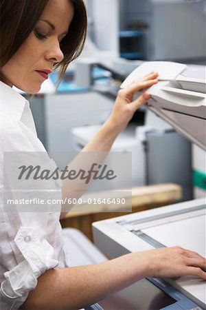 Businesswoman Using Photocopier