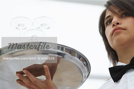 Waitress Carrying Tray of Glasses