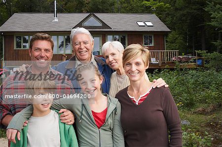 Portrait of Extended Family by Cottage