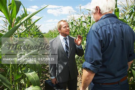 Farmer and Businessman in Cornfield