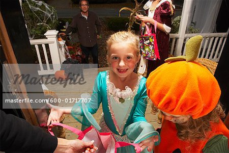 Portrait of Girl and other Children Trick or Treating at Halloween