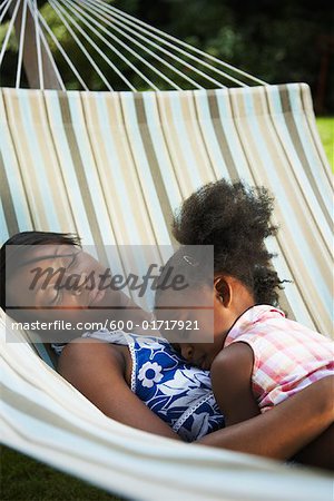 Mother and Daughter Sleeping in Hammock