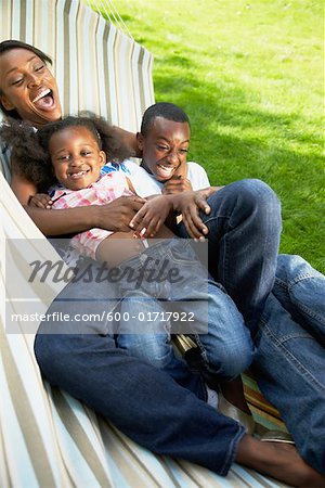 Mother with Son and Daughter in Hammock