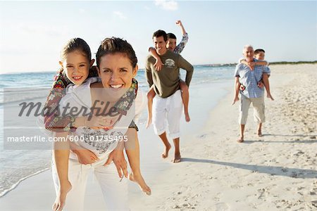 Family Running on the Beach