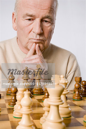 Person Playing Chess Game on Chess Board · Free Stock Photo