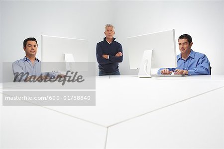 Portrait of Business Team with Computers