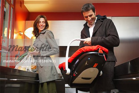 Parents with Baby in Baby Carrier