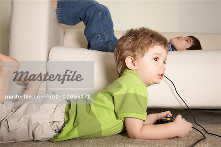 Premium Photo  Child playing computer games