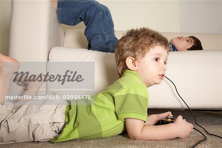 Children playing video game - Stock Photo - Masterfile - Premium