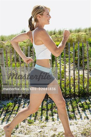 Woman Running on the Beach