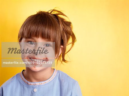 Portrait of Girl With Spaghetti Sauce on Face