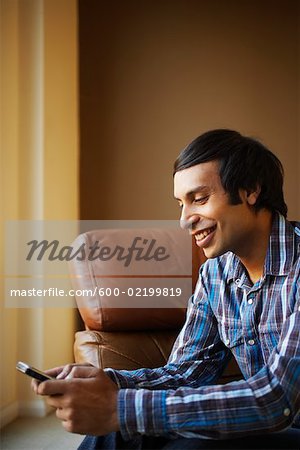 Man Using Electronic Organizer