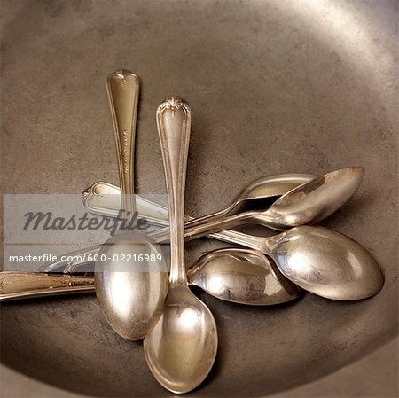 Silver Spoons on Round Silver Plate