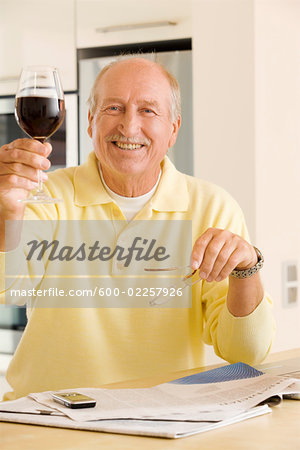 Portrait of Man Raising Glass of Wine