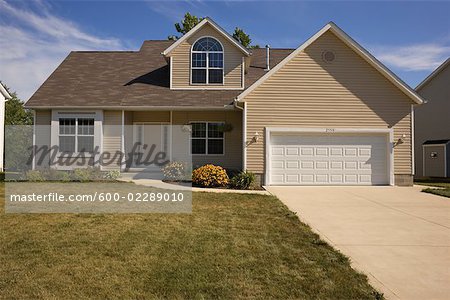 Exterior of Suburban House With Dry Lawn in the Summer, Ohio, USA