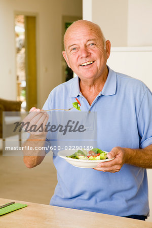 Portrait of Man Eating Salad