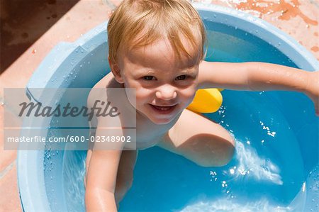 Little Boy in Plastic Tub