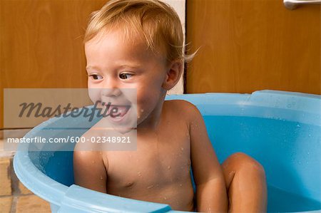 Little Boy in Plastic Tub