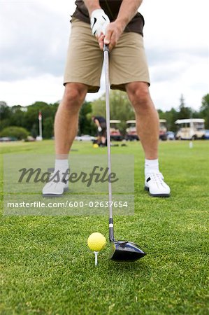 Close-up of Man Teeing Off on Golf Course, Burlington, Ontario, Canada