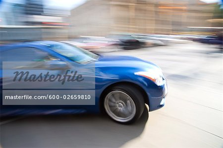 Sports Car in Motion on Street, Toronto, Ontario, Canada
