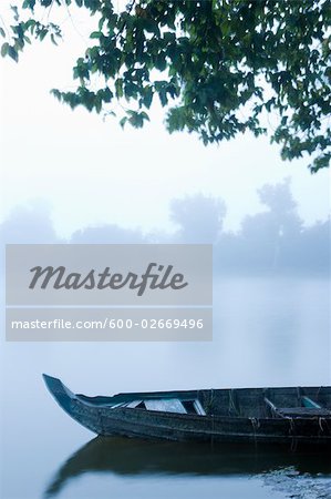 Canoe in Morning Mist at Sras Srang, Angkor, Cambodia