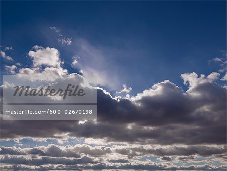 Late Afternoon Sun Peeking Through Clouds