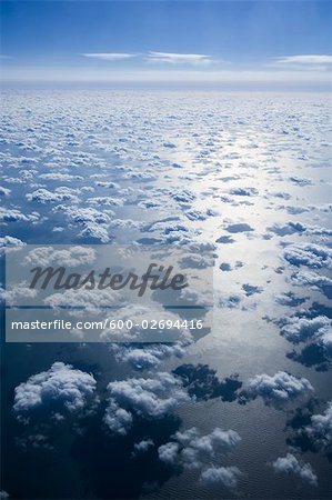 Aerial View of Clouds and Blue Sky Over Pacific Ocean