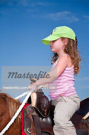 Girl Horseback Riding in the Black Hills, Custer State Park, South Dakota, USA