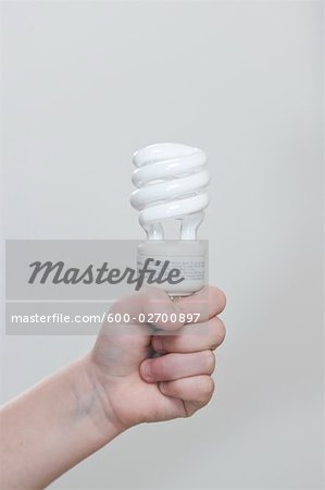 Child Holding Energy Efficient Lightbulb