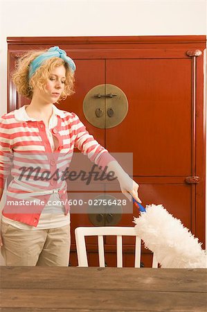 Woman Dusting Table